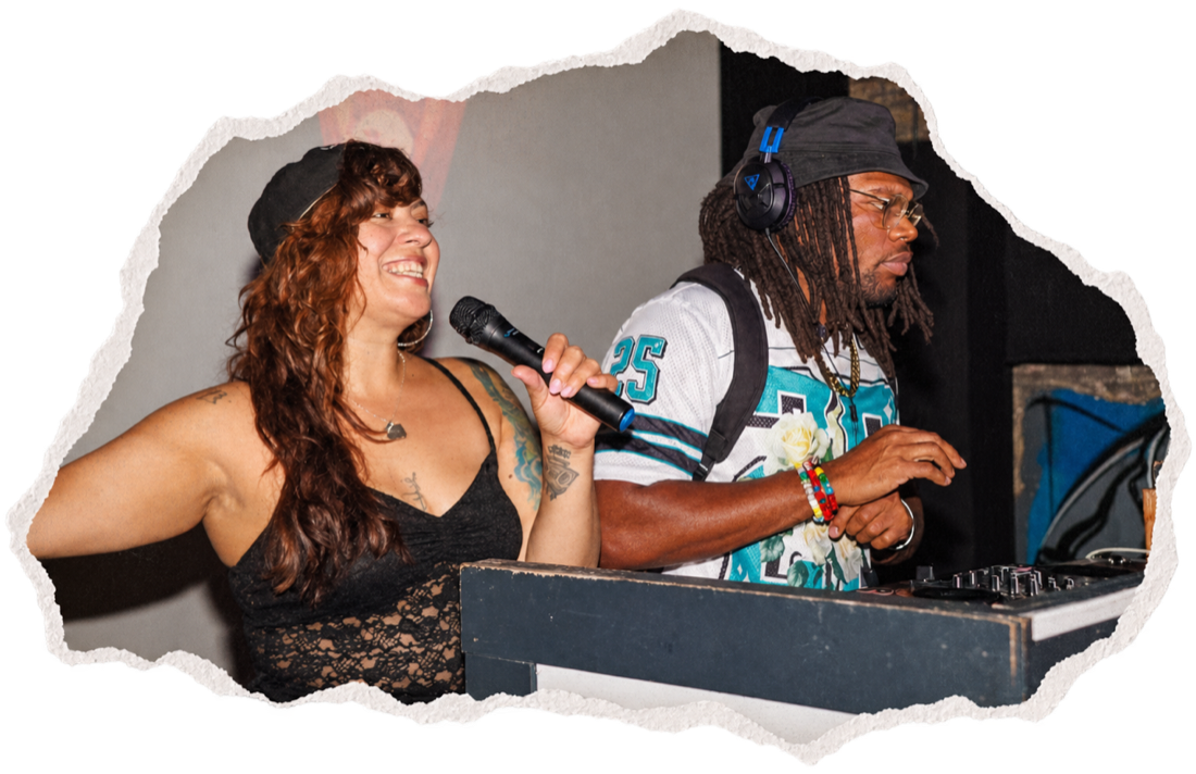 A vocalist on the mic next to N.Harmonix mixing